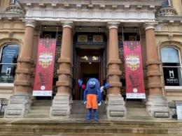 Image shows DiGBY the recycling mascot outside Ipswich Town Hall