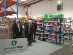 Staff at the Dyslexia Shop with Cllr Ellesmere in the warehouse area