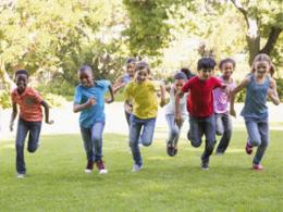 Happy kids running in park