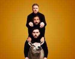 Promoters tour image shows the trio with a sheep