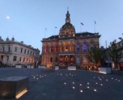 Image shows Ipswich Town Hall and the Cornhill lit up at night