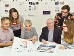 Students showcasing their design to Council leader