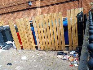 Waste overflowing from bins and in courtyard at Saxon House, Ipswich