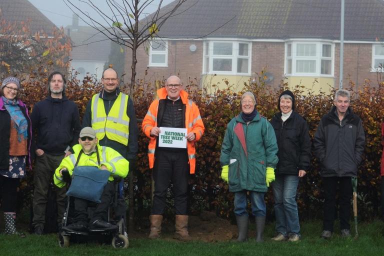 A photo of a group of Ipswich Tree Warden Network volunteers gathered in a park during National Tree Week 2022.