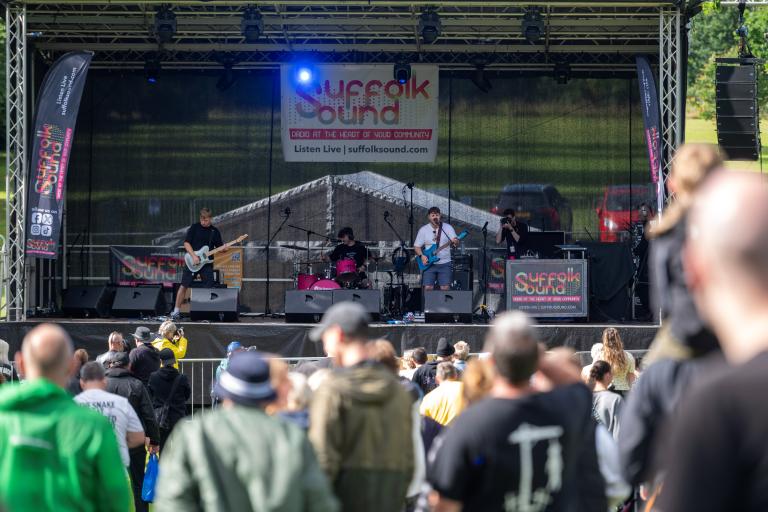 People watching musicians perform on stage
