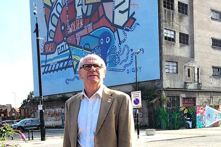 Councillor Neil MacDonald standing at Ipswich Waterfront