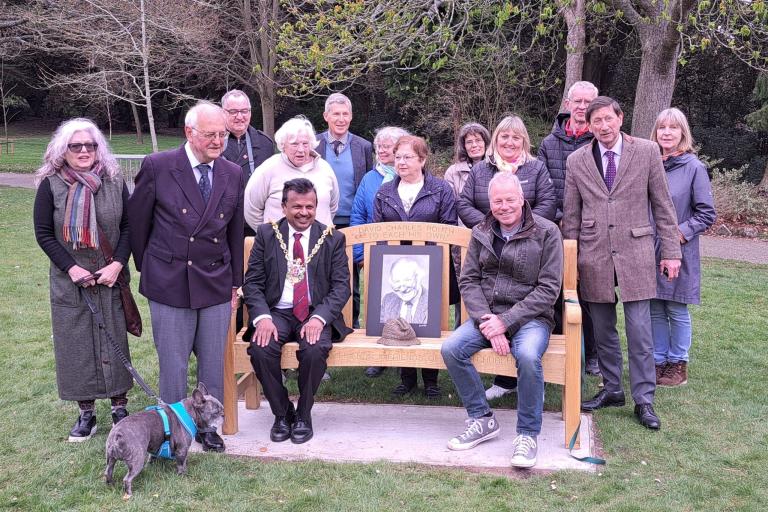 The Friends of Christchurch Park gather around a bench donated for David Routh in Christchurch Park