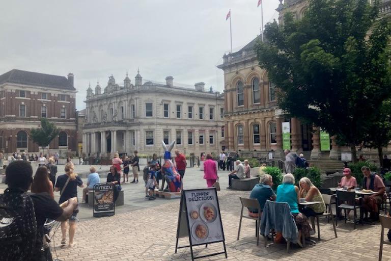 Cornhill town centre Ipswich with people eating outside