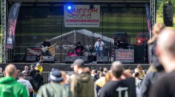People watching musicians perform on stage
