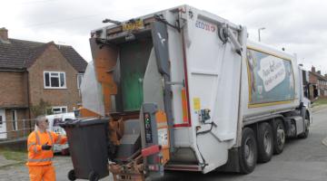 A black bin being collected in Ipswich