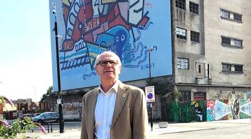 Councillor Neil MacDonald standing at Ipswich Waterfront