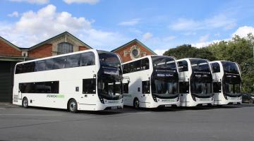 Four double deck buses