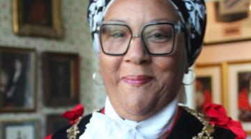 Deputy Mayor of Ipswich wearing her robes and chain of office