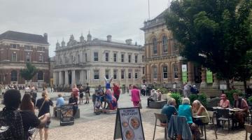 Cornhill town centre Ipswich with people eating outside